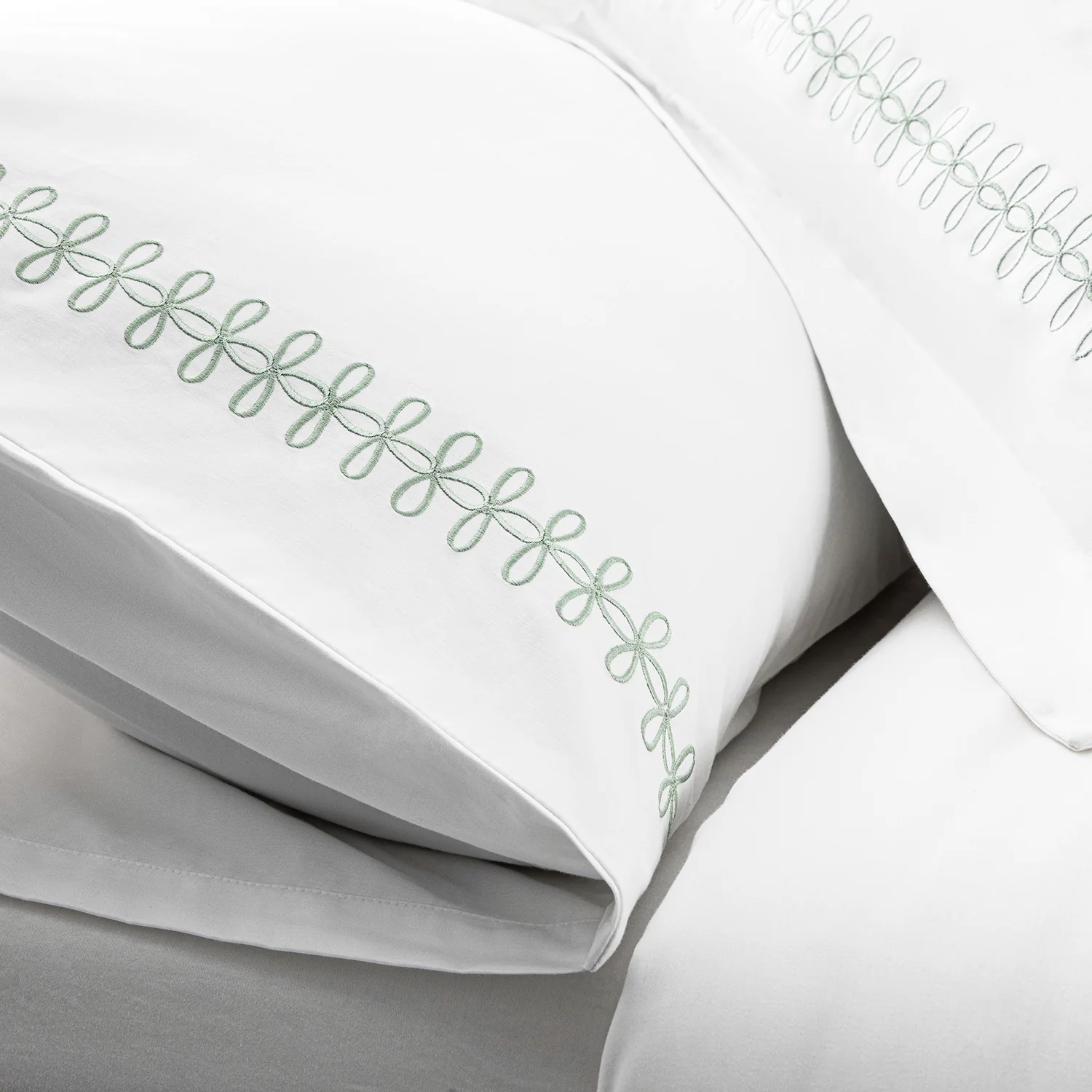 Milano Sea Spray Green Knot Embroidered 600 Thread Count Cotton Sateen Regular Pillowcases - Pair - Image 5